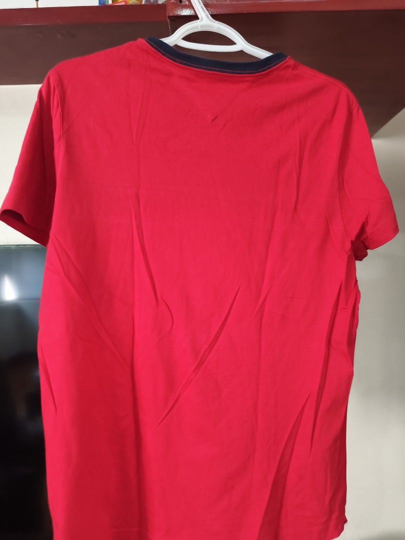 Tommy Hilfiger Red T-shirt (Category: Tshirts & Polo Shirts ) located in Quezon City. Submitted by barryallen76 (Listing ID 1450406509, Image 2). Description: - Classic red Tommy Hilfiger t-shirt - Features the iconic Tommy Hilfiger logo across the chest - Accented with white and navy stripes - Comfortable crew neck with navy trim - Ideal for casual everyday wear Dimension 48x69 (chest x length).