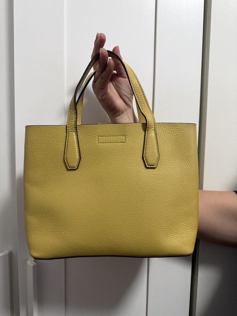 Tory Burch Yellow Leather Tote Bag with Strap (Category: Luxury Bags & Wallets) located in Cainta. Submitted by jen_cas (Listing ID 1450383590, Image 2). Description: - Tory Burch yellow pebbled leather tote bag - Detachable crossbody strap included - Interior zip pocket and main compartment - Gold hardware - Clean inside and out - Ideal for everyday use - guaranteed original - payment first before delivery.