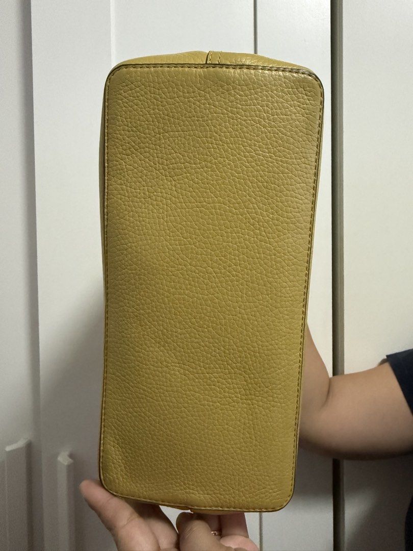 Tory Burch Yellow Leather Tote Bag with Strap (Category: Luxury Bags & Wallets) located in Cainta. Submitted by jen_cas (Listing ID 1450383590, Image 3). Description: - Tory Burch yellow pebbled leather tote bag - Detachable crossbody strap included - Interior zip pocket and main compartment - Gold hardware - Clean inside and out - Ideal for everyday use - guaranteed original - payment first before delivery.