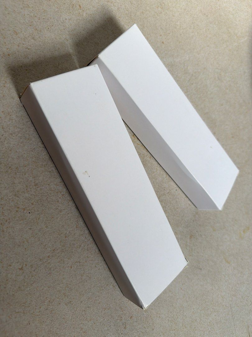 Two White Rectangular Packaging Boxes (Category: Storage Boxes & Baskets) located in Singapore. Submitted by otfuxed (Listing ID 1450343055, Image 1). Description: - Selling 2 white rectangular boxes - Plain and simple design - Ideal for storage or shipping - Boxes are clean and ready for use.