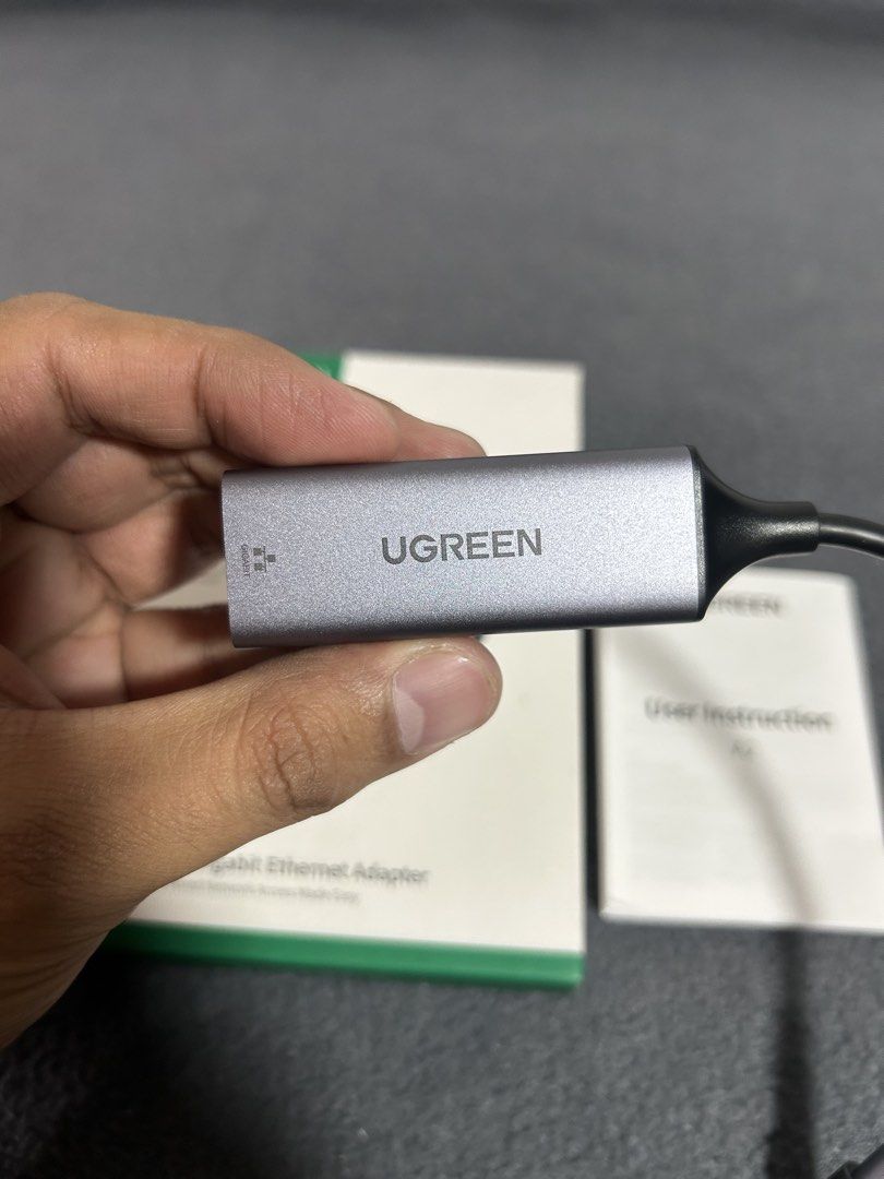 UGREEN USB-C to Gigabit Ethernet Adapter CM199 (Category: Cables & Adaptors) located in Baguio. Submitted by tristanzachary (Listing ID 1450519182, Image 2). Description: - UGREEN USB-C to Gigabit Ethernet Adapter - Supports 1000Mbps high-speed wired network - Premium aluminum alloy casing for durability - Driver-free installation (Windows, Mac, Android, iOS) - Connects via USB-C port - Ensures a stable and reliable internet connection.