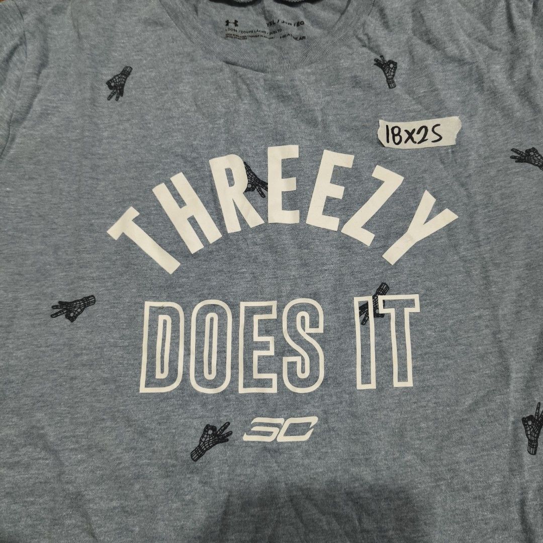 Under Armour SC30 "Shoot Like Steph" & "Threezy Does It" T-shirts (Category: Tshirts & Polo Shirts ) located in Paranaque City. Submitted by bella0712 (Listing ID 1450503912, Image 2). Description: - Bundle Deal: Get both Under Armour t-shirts! - Size: YXL/JTG/FBG - Grey T-shirt: Features 'Shoot Like Steph' graphic - Light Blue T-shirt: Features 'Threezy Does It' print and small graphic pattern - Perfect for basketball fans and Steph Curry enthus