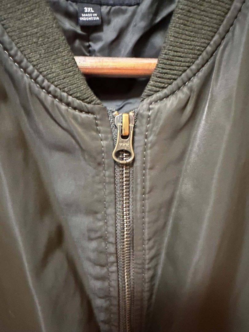 Uniqlo Bomber Jacket Olive Green Size 3XL (Category: Coats, Jackets and Outerwear) located in Caloocan City. Submitted by prelovebyoreo (Listing ID 1450336739, Image 3). Description: Best fit for Large to XL length 23 Width 24 - Uniqlo Olive Green Bomber Jacket - Classic bomber style - Ribbed collar, cuffs, and hem - Zipper closure - Two front pockets - Made in Indonesia - Ideal for layering.