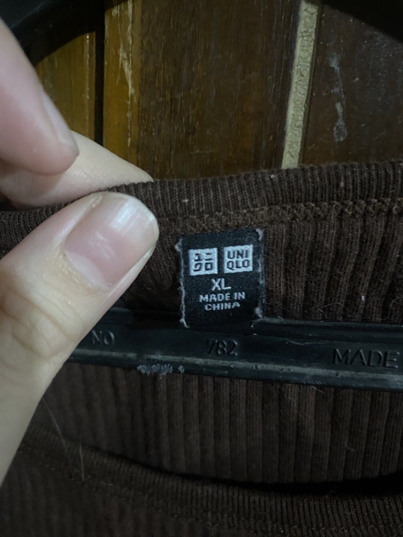 UNIQLO Brown Knitted Crop Top (Category: Shirts) located in Bacoor. Submitted by deaclutter.ph (Listing ID 1450444832, Image 2). Description: > Stretchy > Used 3-5 times > Can ask for when worn pic > No COD > GCash, GoTYME, Maya > MOD: lalamove or jnt > SF paid by buyer note: cat fur visible in pic, can be removed easily.