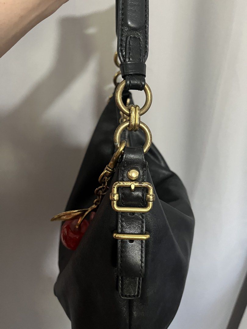 Vintage Coach Harrison Hobo Bag (Category: Luxury Bags & Wallets) located in Cavite. Submitted by celine_preloves (Listing ID 1450415169, Image 3). Description: Authentic vintage Coach black leather hobo bag. Features gold hardware and a cherry charm. Soft leather, adjustable strap. Great for everyday. .