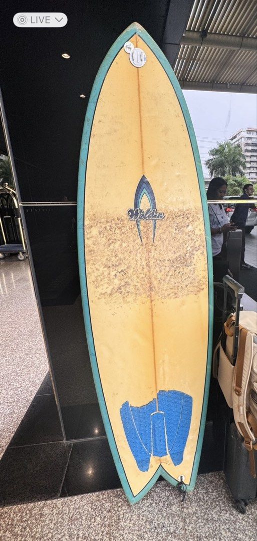 Walden Surfboard 6’4ft fish (Category: Water Sports) located in Tayabas. Submitted by dudayduday (Listing ID 1450344697, Image 1). Description: - Yellow Walden surfboard - Blue trim - Includes tail pad - with fins and leash.