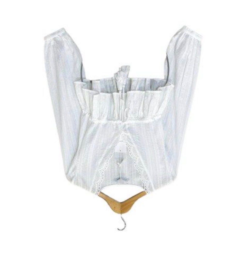 White Peplum Blouse with Lace Trim (Category: Blouses) located in Manila. Submitted by decluterthings888 (Listing ID 1450408433, Image 1). Description: - Cute white peplum blouse - Long sleeves - V-neck with delicate lace trim - Drawstring tie at the waist - Ruffled hemline - Versatile: pairs well with jeans or skirts - Ideal for casual outings or nights with friends.