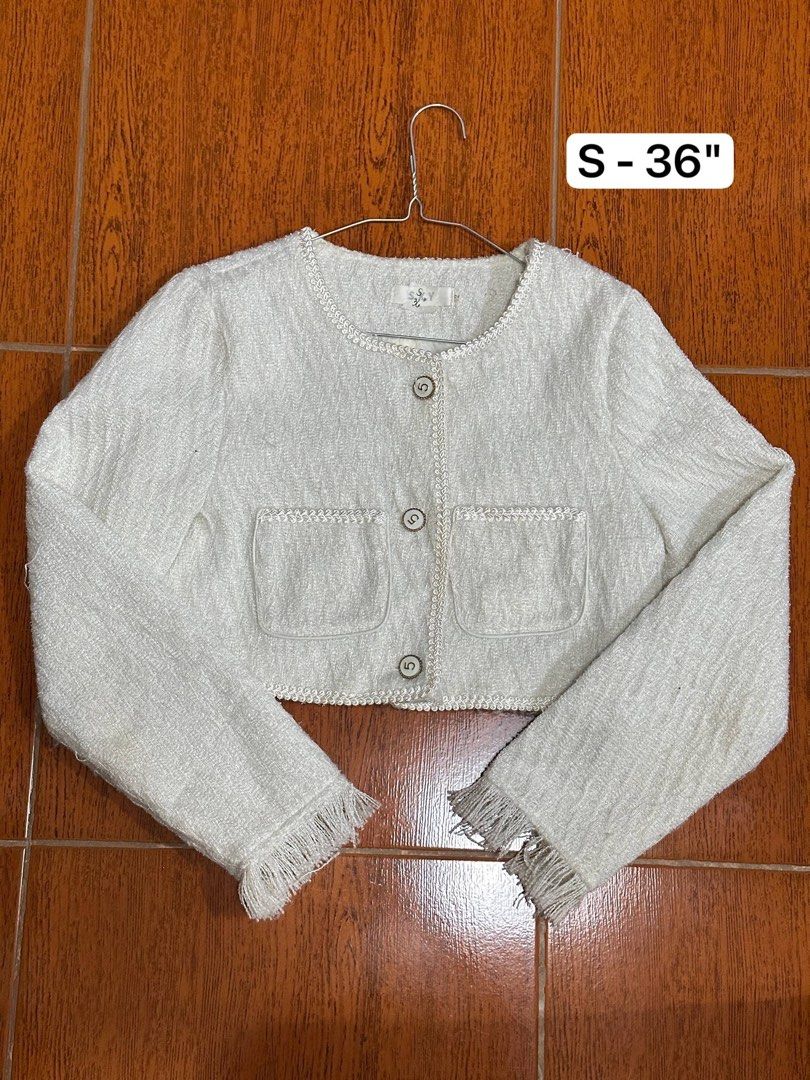 White Tweed Cropped Jacket with Fringed Hem (Category: Coats, Jackets and Outerwear) located in Cainta. Submitted by glycellepa98112 (Listing ID 1450337413, Image 1). Description: - Cute white tweed cropped jacket - Round neckline - Button-up front - Two front pockets - Fringed details on sleeves and hem - Pairs perfectly with high-waisted bottoms for a chic look.