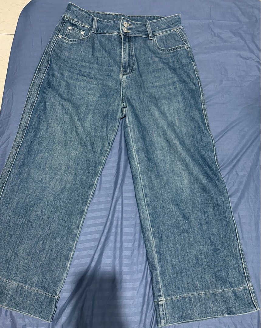 Wide Leg High Waist Jeans (Category: Jeans) located in Mandaluyong City. Submitted by blzstr (Listing ID 1450433126, Image 2). Description: - Style: Wide leg denim jeans - Size: 4XL on tag but fits large well - waist 33inches - slightly stretchy - Color: Classic blue wash - Closure: Double button at waist - Pockets: Two front, two back - Fit: Relaxed, with wide leg opening.