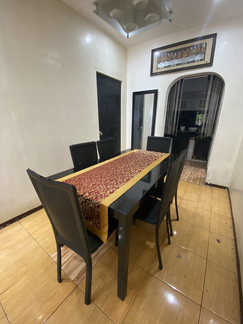 6- Person Dining Table (Category: Tables & Sets) located in Manila. Submitted by burritoenthusiast_5 (Listing ID 1450608848, Image 2). Description: 6-Person Glass Black Dining Table Dimension: 140x80cm Honest Issue: Flaking Leather Chairs (negotiable price).