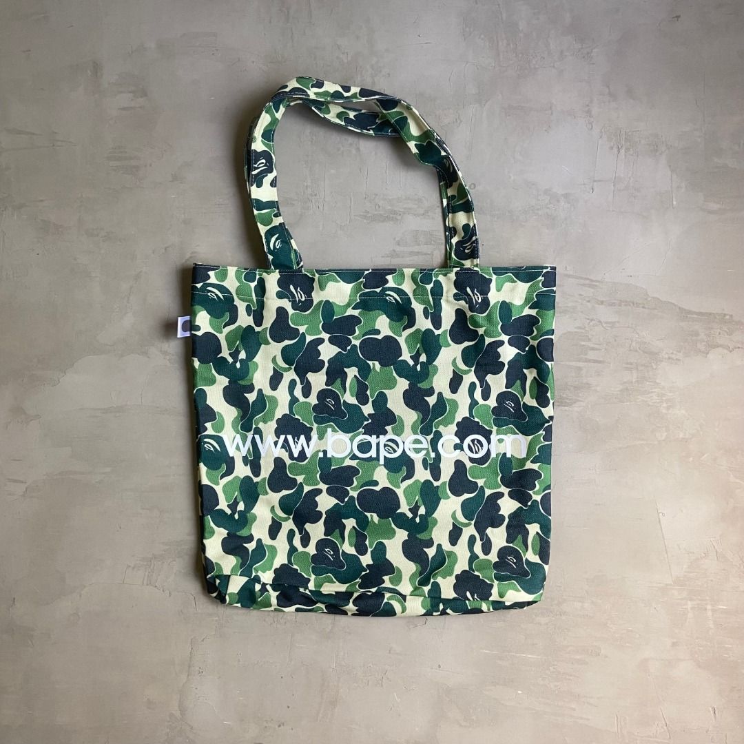 A Bathing Ape BAPE Camo Tote Bag (Category: Tote Bags) located in Pasig City. Submitted by precycled_ (Listing ID 1450612871, Image 2). Description: Code : A Bathing Ape BAPE Camo Tote Bag Condition : Brandnew Price : 699 php Issue : None . . . ‼️BUY AT YOUR OWN RISK ❗Payment First Basis 📌Be 100% SURE before submitting the form 📌1 DAY Reservation ONLY! ❌No Pick-up / No Meet up ❌No RETURN / EXCHANGE ❌No RUSH ❌No CANCELLATIONS ❌Don't BUY our prod