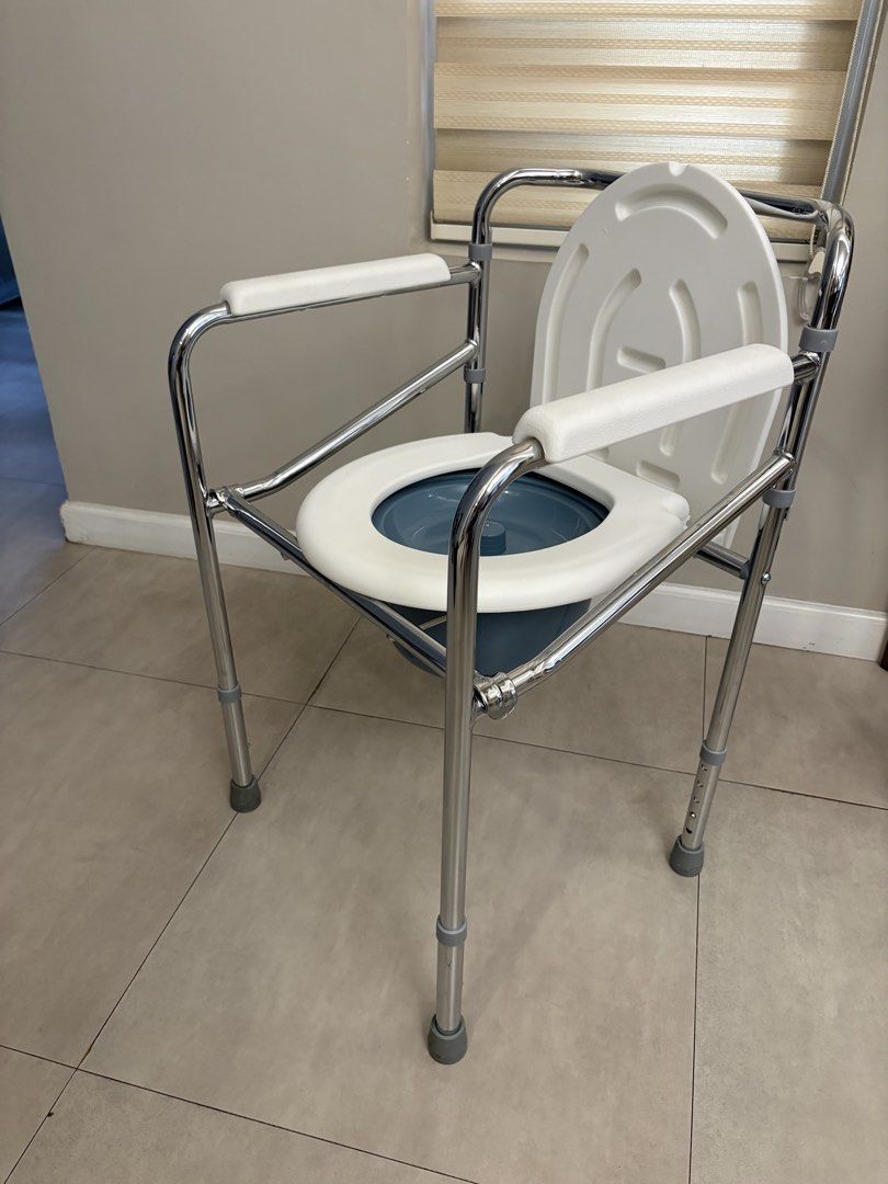 Adjustable Commode Chair with Padded Seat and Arms (Category: Medical Supplies & Tools) located in Taytay. Submitted by mybaby01 (Listing ID 1450587473, Image 2). Description: - Padded armrests for comfort - Cushioned seat for extra support - Adjustable height for personalized fit - Sturdy metal frame for durability - Easy to clean and maintain - Provides excellent mobility assistance.