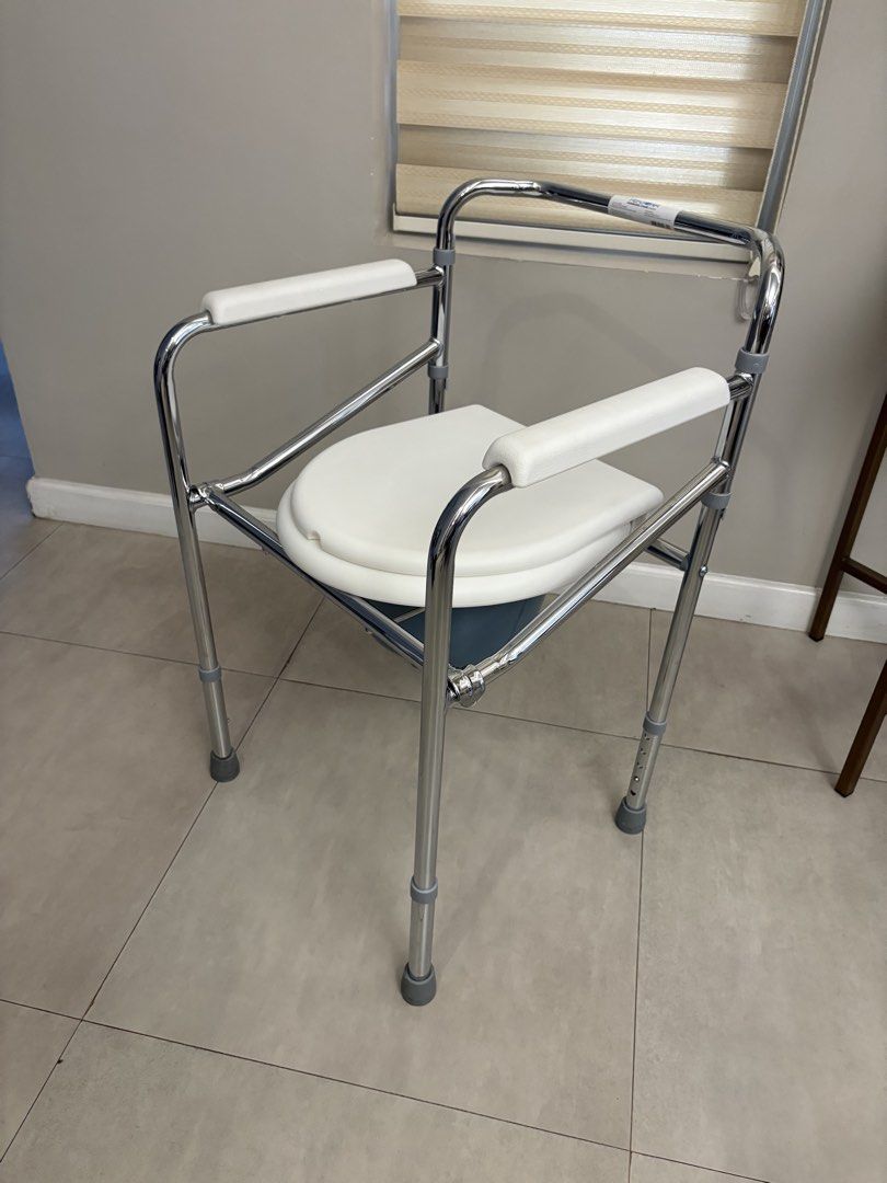 Adjustable Commode Chair with Padded Seat and Arms (Category: Medical Supplies & Tools) located in Taytay. Submitted by mybaby01 (Listing ID 1450587473, Image 1). Description: - Padded armrests for comfort - Cushioned seat for extra support - Adjustable height for personalized fit - Sturdy metal frame for durability - Easy to clean and maintain - Provides excellent mobility assistance.