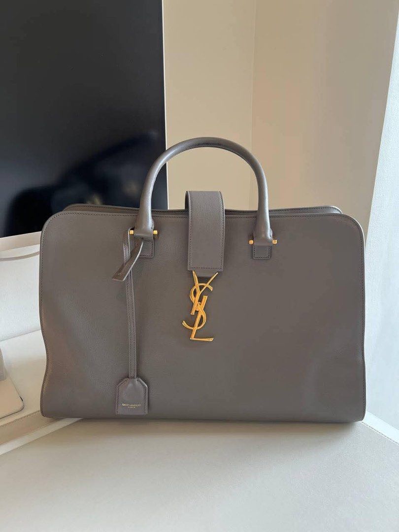 Authentic YSL Tote Bag Saint Laurent Grey Monogram Cabas Large (Category: Luxury Bags & Wallets) located in Manila. Submitted by shopforless93 (Listing ID 1450541835, Image 1). Description: Authentic YSL Saint Laurent Cabas Tote Bag - Large Size - Genuine Leather - Signature Gold YSL Logo Hardware - Top Handle and Detachable Shoulder Strap - Includes Original Leather Tag - Ideal for Everyday Use RFS : decluttering stuff at home Original price: 18