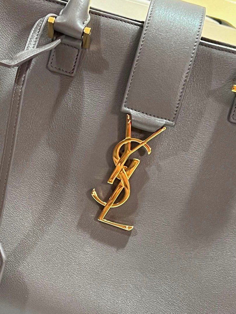 Authentic YSL Tote Bag Saint Laurent Grey Monogram Cabas Large (Category: Luxury Bags & Wallets) located in Manila. Submitted by shopforless93 (Listing ID 1450541835, Image 3). Description: Authentic YSL Saint Laurent Cabas Tote Bag - Large Size - Genuine Leather - Signature Gold YSL Logo Hardware - Top Handle and Detachable Shoulder Strap - Includes Original Leather Tag - Ideal for Everyday Use RFS : decluttering stuff at home Original price: 18