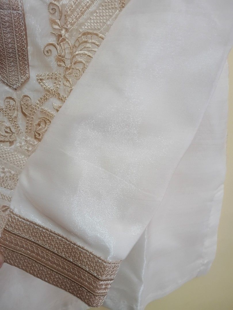 Barong Tagalog with Beige Embroidery (Category: Formal Shirts) located in Binangonan. Submitted by chingtp (Listing ID 1450633910, Image 3). Description: - Traditional Filipino Barong Tagalog - Color: Beige - Fabric: Sheer - Design: Intricate beige embroidery on front and collar - Closure: Button-up - Occasion: Perfect for formal events, cultural celebrations, or special occasions - Condition: Brandnew.