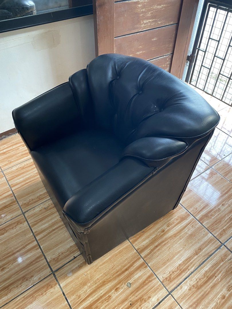Black Leather Tufted Armchair Single Seater Sofa (Category: Chairs) located in Manila. Submitted by burritoenthusiast_5 (Listing ID 1450609962, Image 2). Description: - Classic black faux leather single seater armchair - Features deep button tufting on the backrest - Plush cushioning for ultimate comfort - Sturdy and durable build - Versatile: Ideal for living rooms, bedrooms, or offices - Easy to clean and maintain.