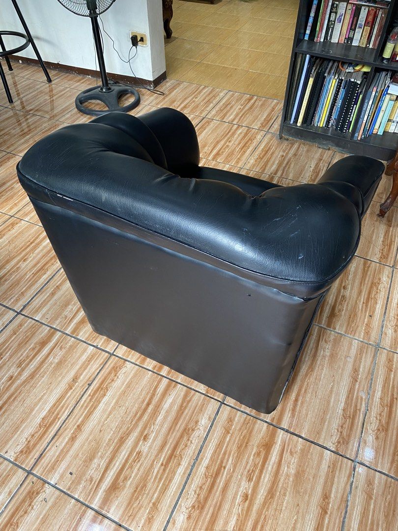 Black Leather Tufted Armchair Single Seater Sofa (Category: Chairs) located in Manila. Submitted by burritoenthusiast_5 (Listing ID 1450609962, Image 3). Description: - Classic black faux leather single seater armchair - Features deep button tufting on the backrest - Plush cushioning for ultimate comfort - Sturdy and durable build - Versatile: Ideal for living rooms, bedrooms, or offices - Easy to clean and maintain.