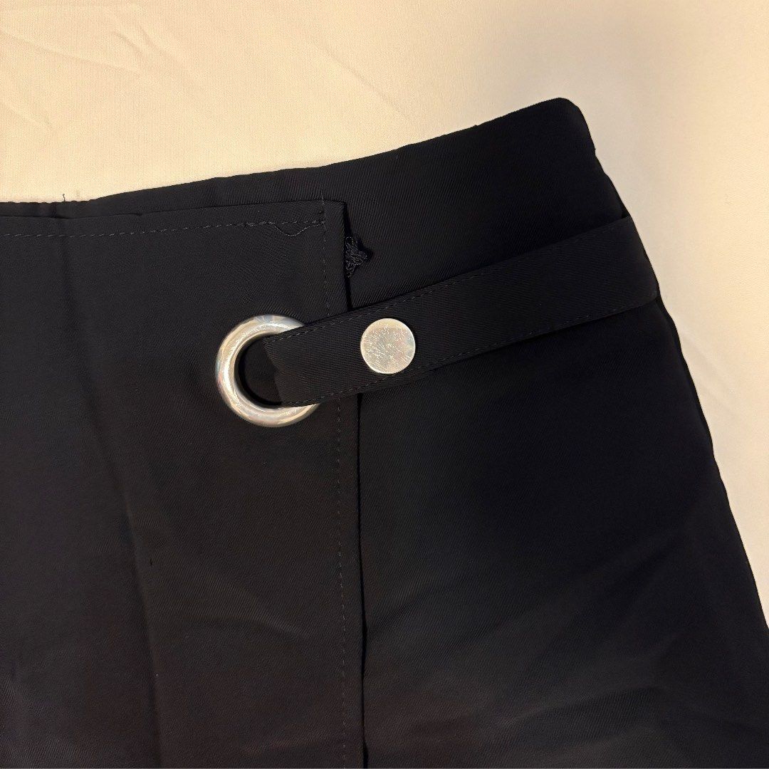 Black Midi Skirt with Silver Hardware Detail (Category: Skirts) located in Santiago. Submitted by archive.drippp (Listing ID 1450715977, Image 2). Description: - Elegant black midi skirt - size 24-25 waistline - 14.5in length - Convenient back zipper closure .
