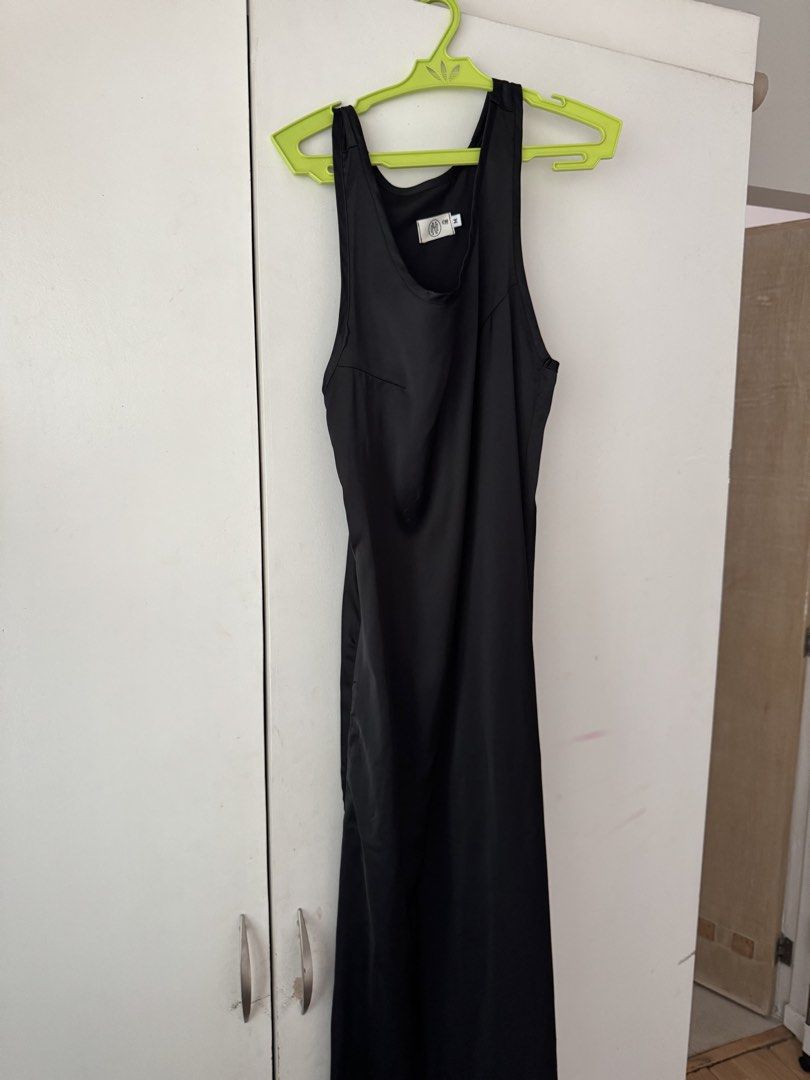 Black Sleeveless Silk Maxi Dress (Category: Dresses) located in Muntinlupa City. Submitted by francesca14 (Listing ID 1450561475, Image 1). Description: - Simple black sleeveless maxi dress - Tank top style straps - Floor-length design - Versatile for dressing up or down - Ideal for layering or wearing solo - A must-have wardrobe staple Used only once Bought it for ₱1017 RFS: decluttering.