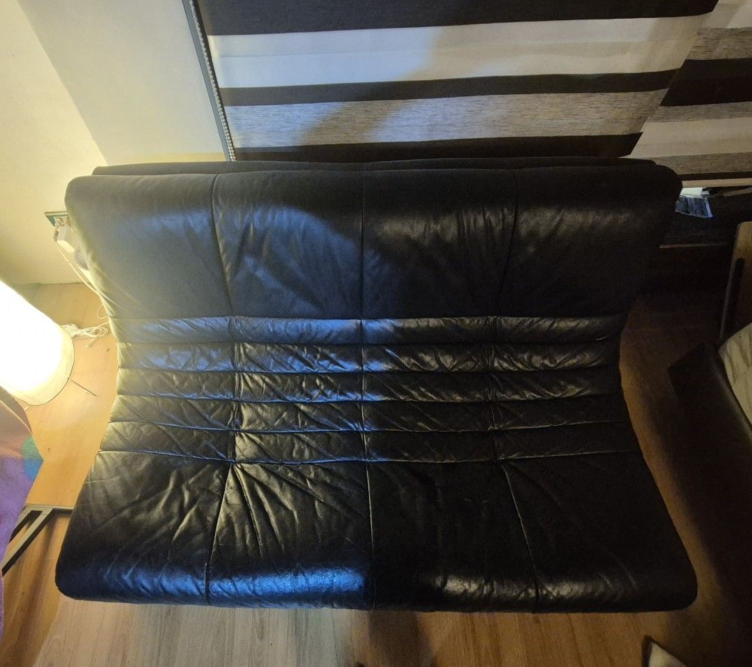 Black Togo Caterpillar 2 seater sofa (Category: Sofas) located in Manila. Submitted by shanecastro (Listing ID 1450578566, Image 3). Description: Selling a black leather sofa. It has a quilted design on the cushions. The sofa is quite spacious. Wood flooring visible around it. Good for a living room setup. Let me know if you have questions..