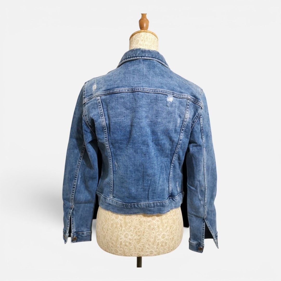 Blue Distressed Denim Jacket (Category: Coats, Jackets and Outerwear) located in Mandaue City. Submitted by stylefigjam (Listing ID 1450536634, Image 2). Description: - Classic blue denim jacket - Distressed look for a cool vibe - Button-up front closure - Two chest pockets - Ideal for layering over any outfit - Highly versatile for various styles.