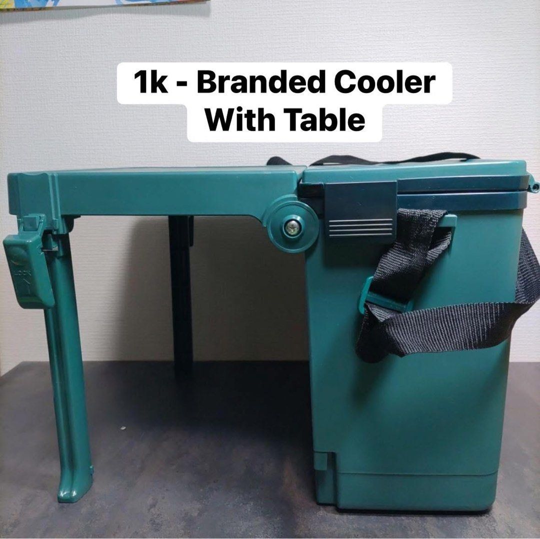 Branded Cooler Box with Foldable Table (Category: Storage Boxes & Baskets) located in Quezon City. Submitted by m2yjapansurplus_quezoncity (Listing ID 1450711881, Image 1). Description: - kulang lang isang Lock. Aside from that its good. Orig Price nito 3k+ Green cooler box with integrated foldable table - Ideal for picnics, camping, and outdoor adventures - Table legs fold neatly for compact storage - Includes a convenient carrying strap - Dimen