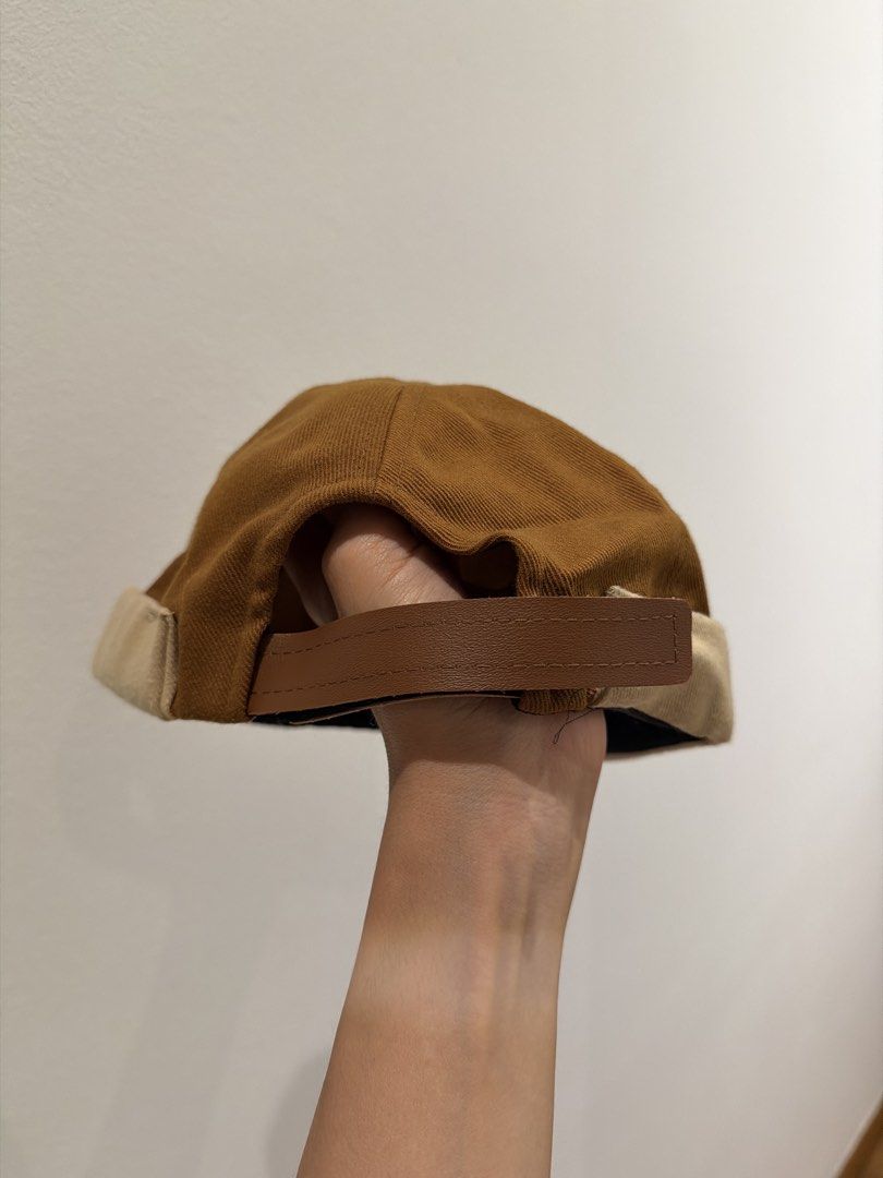 Docker Cap (Category: Caps & Hats) located in Singapore. Submitted by ekohouse (Listing ID 1450691131, Image 2). Description: Cool brown docker cap. Tan brim detail. Adjustable strap at the back. Unworn.