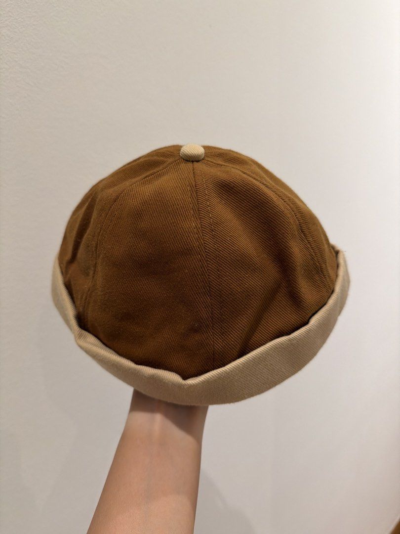 Docker Cap (Category: Caps & Hats) located in Singapore. Submitted by ekohouse (Listing ID 1450691131, Image 1). Description: Cool brown docker cap. Tan brim detail. Adjustable strap at the back. Unworn.