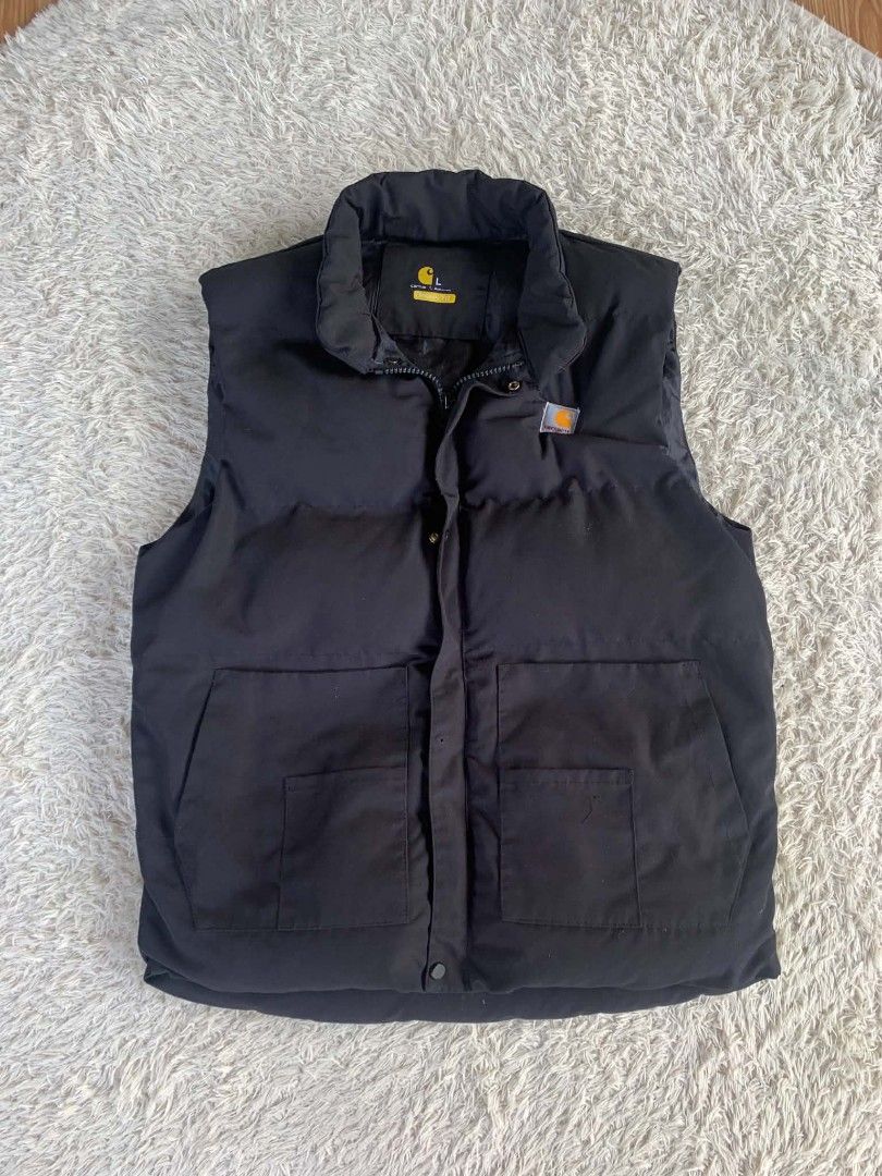 Carhartt Black Puffer Vest (Category: Vests) located in Zarraga. Submitted by eiksyopar (Listing ID 1450583374, Image 1). Description: - Black Carhartt puffer vest - Size: L - Two front pockets with button closures - Zipper front with button snap storm flap - Ideal for layering.