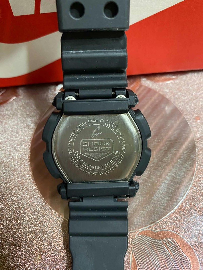 Casio G-Shock DW-9052 Black Gold Watch (Category: Men's Watches) located in Lingayen. Submitted by jayteeeezy (Listing ID 1450624274, Image 3). Description: - Model: Casio G-Shock DW-9052 - Color: Black with gold accents - Water Resistance: 20 Bar (200 meters) - Features: Shock absorbing structure, Illuminator light - Condition: Works well - Best for: Everyday wear or sports.
