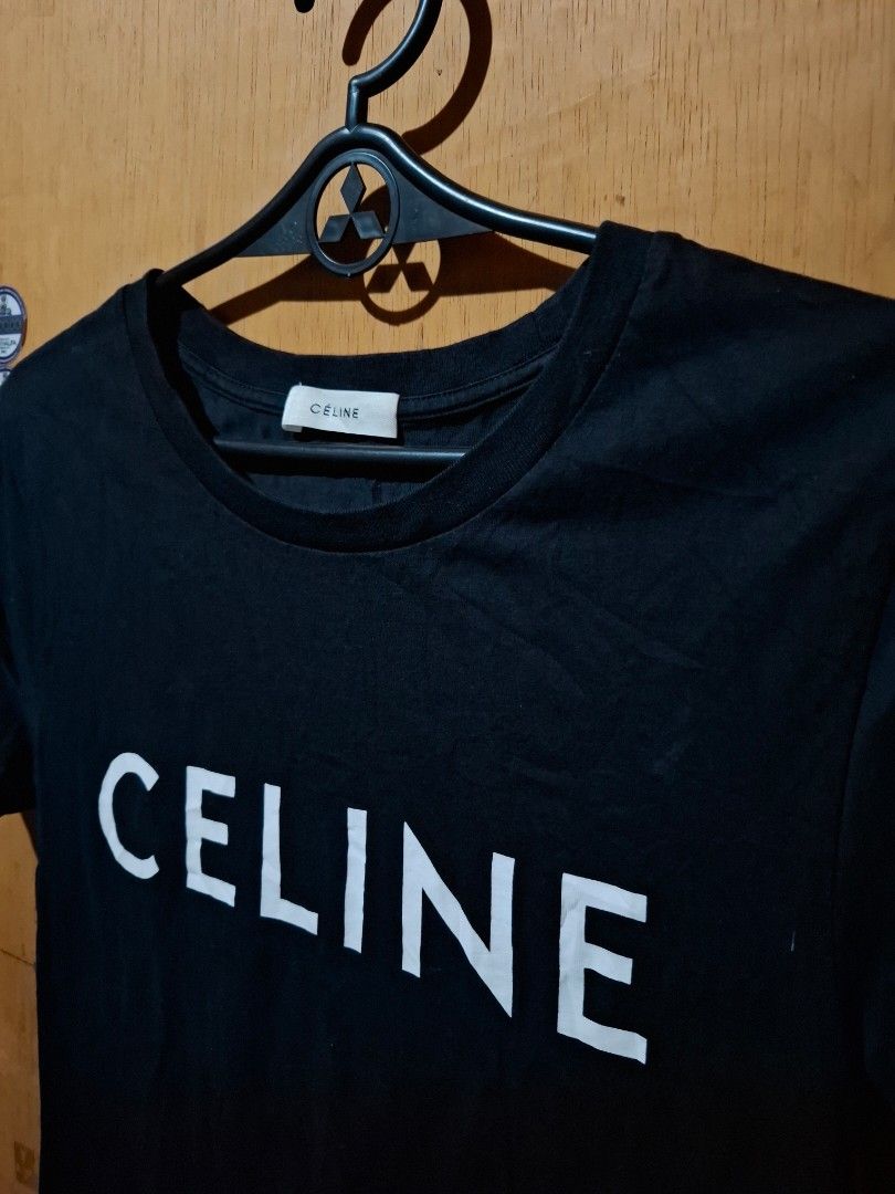 Celine Paris Black T-shirt (Category: Shirts) located in Victorias. Submitted by doc_keith (Listing ID 1450683207, Image 2). Description: - Authentic Celine T-shirt - Color: Black with white logo - Material: 100% Cotton - Origin: Made in Portugal - Style: Simple, classic, perfect for everyday wear -Size small (15.5x24) -Need wash 580 shipped Negros Occidental.