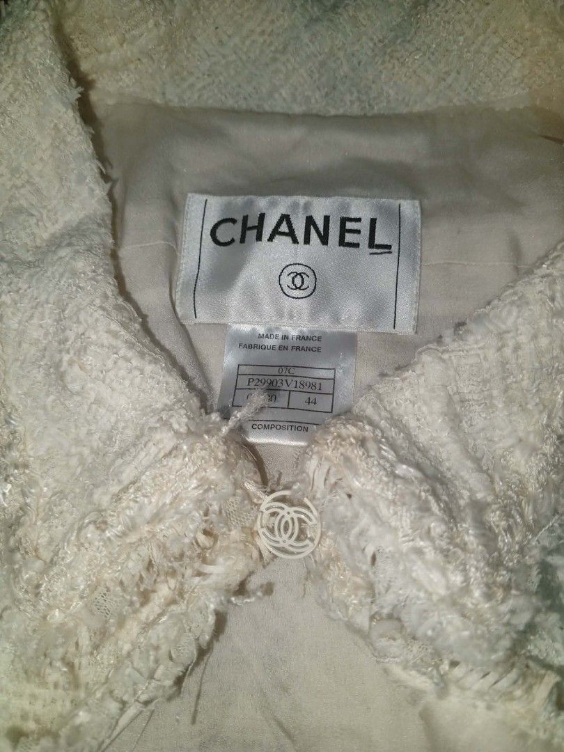 Chanel Tweed Jacket (Category: Tshirts & Polo Shirts ) located in Tagum. Submitted by brightbear.b23cc0 (Listing ID 1450678442, Image 2). Description: - Classic Chanel tweed jacket - Color: Cream/Off-white - Beautiful textured fabric - Two front pockets - Unique collar design - Smooth silk lining - Subtle chain detail along the hem - Timeless and versatile piece.