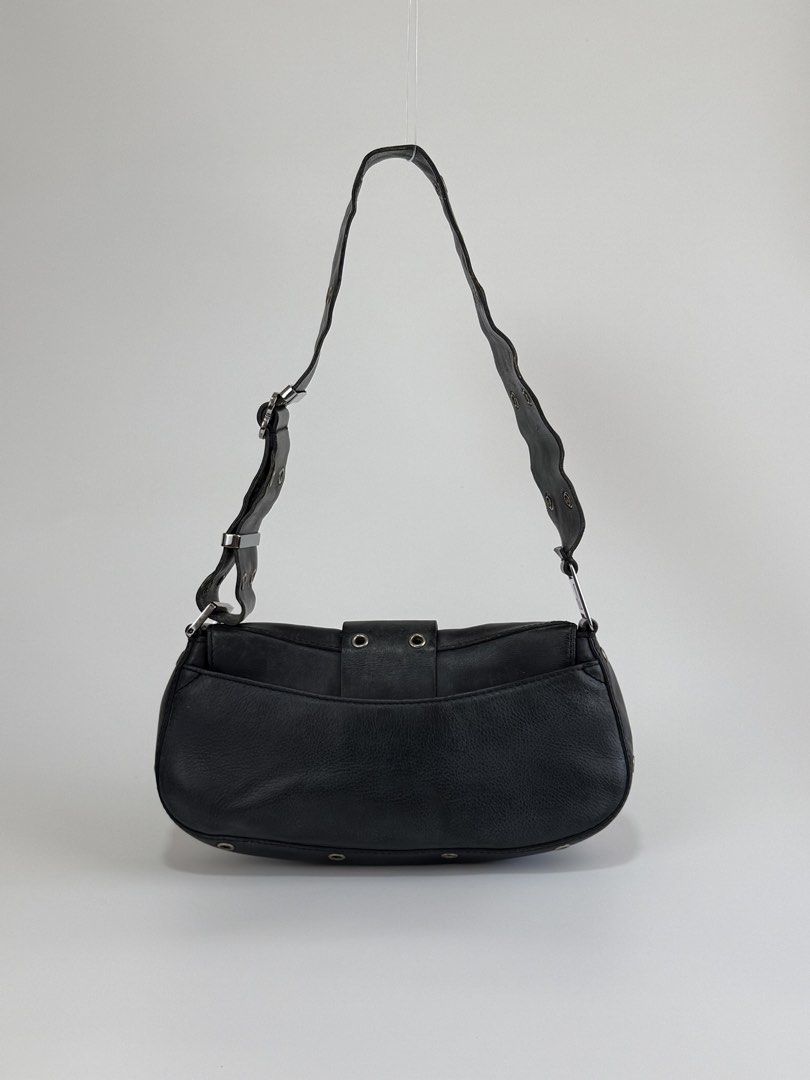 Christian Dior Street Chic Columbus (Category: Luxury Bags & Wallets) located in Burgos, Ilocos Sur. Submitted by robynperalta05 (Listing ID 1450661452, Image 2). Description: Black calf skin leather Silver-tone hardware Slit pocket on the back Adjustable shoulder strap Flap push lock closure Signs of wear Reglued shoulder strap, still soft not stiff Scratches, fading and folds on the leather, consistent with its vintage nature. This is a vintage