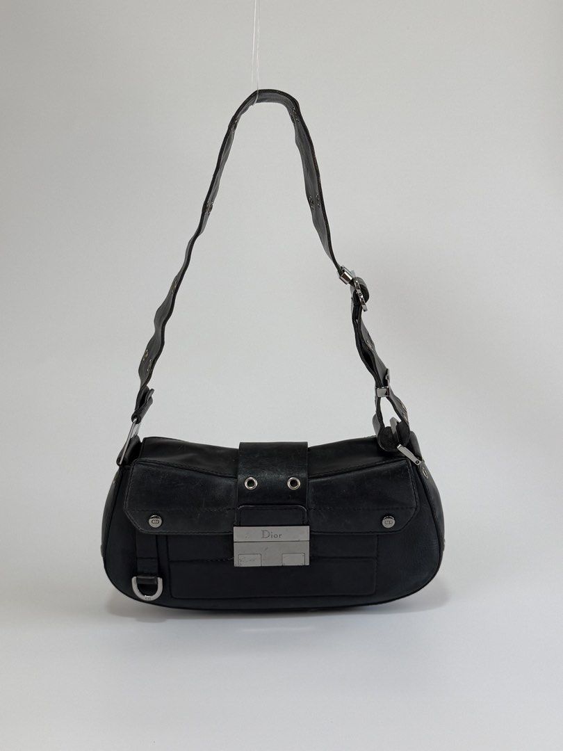 Christian Dior Street Chic Columbus (Category: Luxury Bags & Wallets) located in Burgos, Ilocos Sur. Submitted by robynperalta05 (Listing ID 1450661452, Image 1). Description: Black calf skin leather Silver-tone hardware Slit pocket on the back Adjustable shoulder strap Flap push lock closure Signs of wear Reglued shoulder strap, still soft not stiff Scratches, fading and folds on the leather, consistent with its vintage nature. This is a vintage