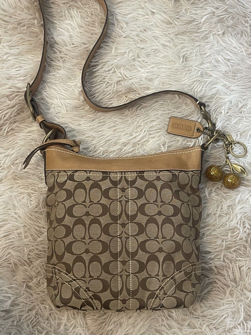 Coach Canvas & Leather Crossbody Bag 10403 (Category: Cross-body Bags) located in Mandaluyong City. Submitted by mattlazz (Listing ID 1450569209, Image 1). Description: - Classic Coach monogram canvas crossbody bag - Tan leather trim and strap - Back zipper pocket for secure storage - Adjustable strap for comfortable wear - Ideal for everyday use - Charm not included - Can fit an iPad, interior is clean Php 3,900 only Pick up/meet up Mandaluyong 