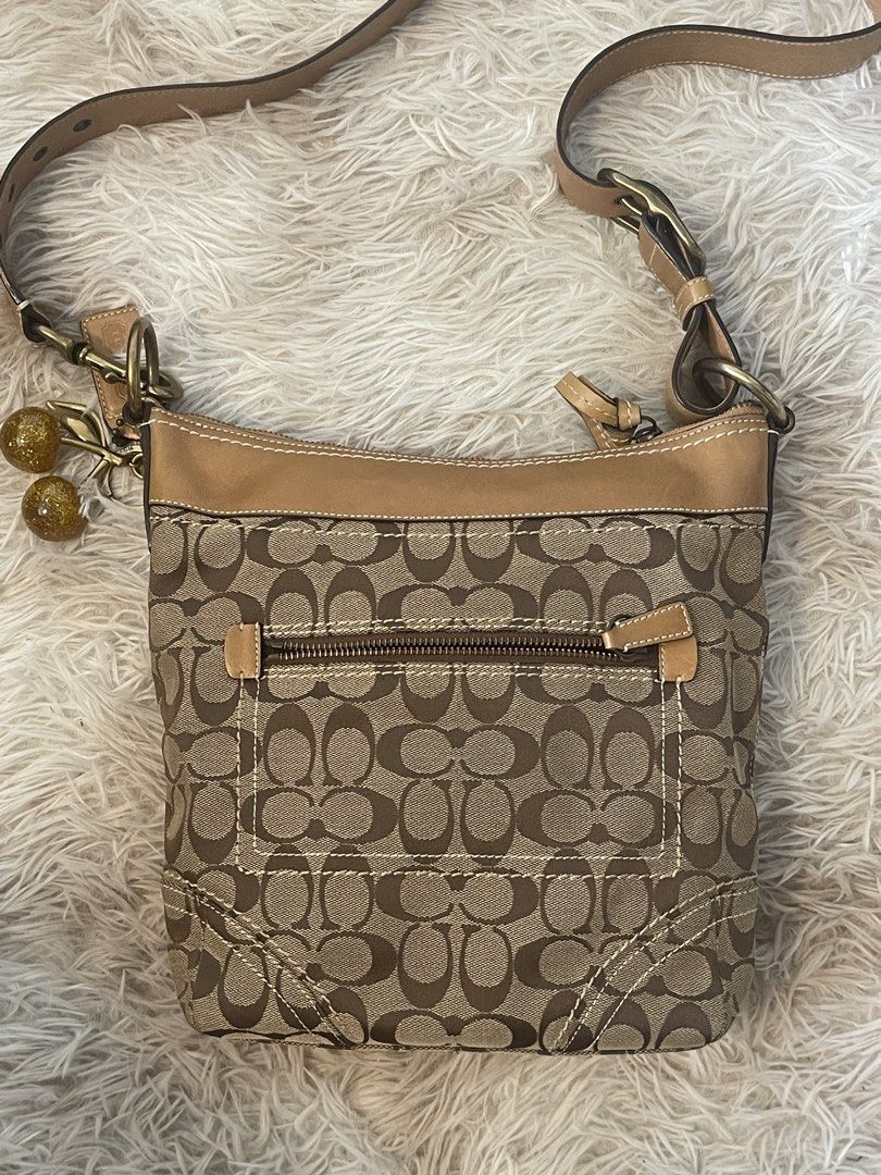 Coach Canvas & Leather Crossbody Bag 10403 (Category: Cross-body Bags) located in Mandaluyong City. Submitted by mattlazz (Listing ID 1450569209, Image 2). Description: - Classic Coach monogram canvas crossbody bag - Tan leather trim and strap - Back zipper pocket for secure storage - Adjustable strap for comfortable wear - Ideal for everyday use - Charm not included - Can fit an iPad, interior is clean Php 3,900 only Pick up/meet up Mandaluyong 
