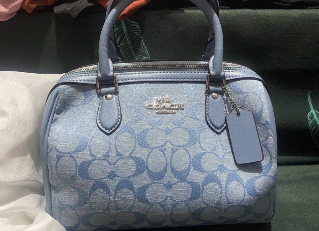 Coach Monogram Canvas Boston Bag Light Blue (Category: Luxury Bags & Wallets) located in Makati City. Submitted by rbarsabal (Listing ID 1450613342, Image 1). Description: - Light blue Coach Boston bag - Classic all-over monogram pattern - Genuine leather handles and trim - Top zipper closure - Front zip pocket - Comes with original Coach hang tag - Ideal size for everyday essentials.