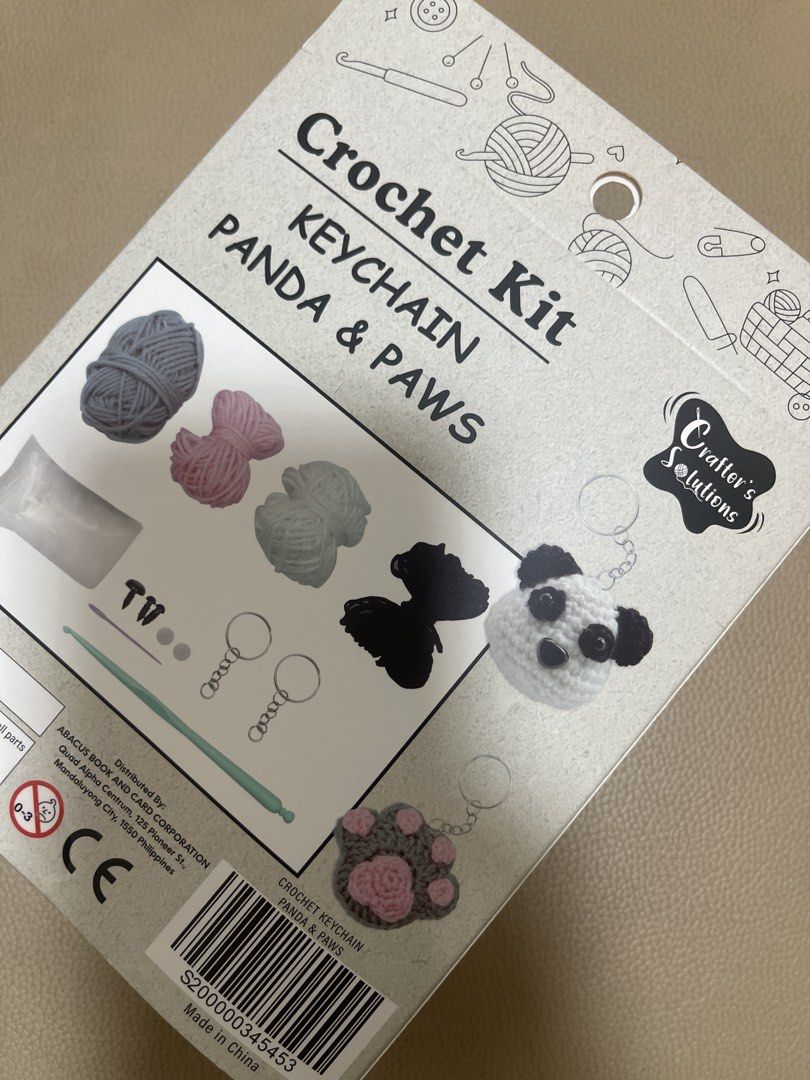 Crafter's Solutions Crochet Kit Keychain Panda & Paws (Category: Handmade Craft) located in Manila. Submitted by preloved.mademoiselle (Listing ID 1450630688, Image 2). Description: - DIY Crochet Kit: Make your own adorable panda and paw keychain! - All-Inclusive: Comes with yarn, stuffing, plastic eyes, keychain ring, crochet hook, plastic needle, and easy-to-follow instructions. - Perfect Size: Finished panda is approx. 5x5 cm, paw is approx. 7