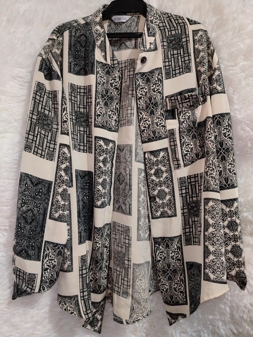 Cream & Black Patchwork Print Button-Up Shirt (Category: Shirts) located in Las Pinas. Submitted by aboutthere (Listing ID 1450639119, Image 1). Description: 📍 Las Piñas City RFS: Need funds Condition: Like New Details: - Cream colored shirt - Black patchwork print - Long sleeves with button cuffs - Button-up front - Relaxed fit - Great for layering or wearing on its own - Unique pattern - Good for casual wear Price is negotiable. 💸 MOP: GCash,