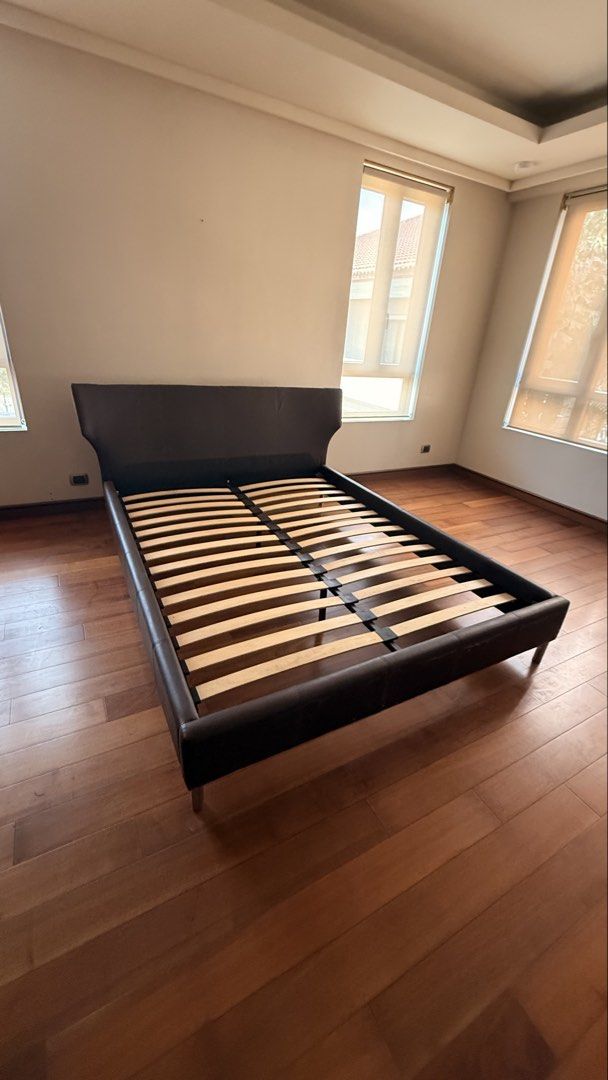 Dark Brown Faux Leather Platform Bed Frame (Category: Bed Frames & Mattresses) located in Quezon City. Submitted by stylesaverph (Listing ID 1450572772, Image 2). Description: - Dark brown faux leather bed frame - Modern, low-profile design - Sturdy construction - Fits queen or king size mattress - Ready for a new home!.