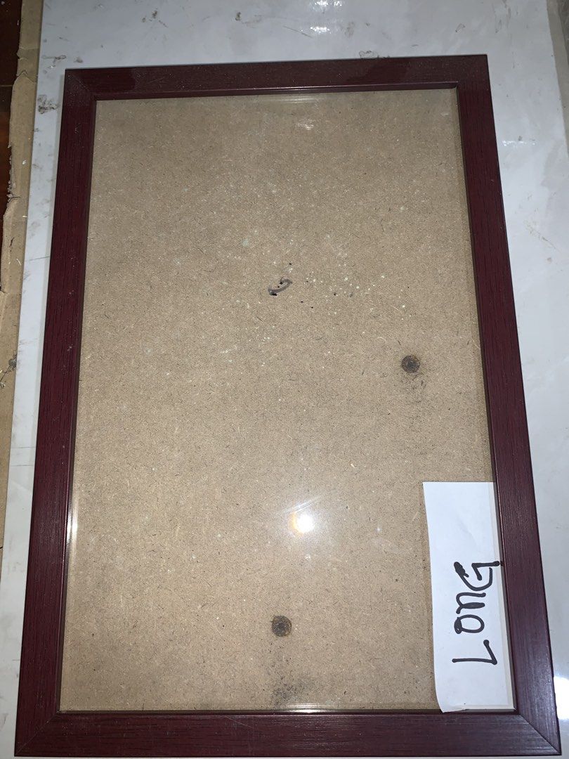 Dark Red Picture Frame (Category: Frames & Pictures) located in Manila. Submitted by shannastore (Listing ID 1450537938, Image 1). Description: - Dark red wooden picture frame - Standard size 8.5X13 (long) , fits photos or art - Features a protective glass front - Comes ready to hang - Ideal for enhancing your home decor.