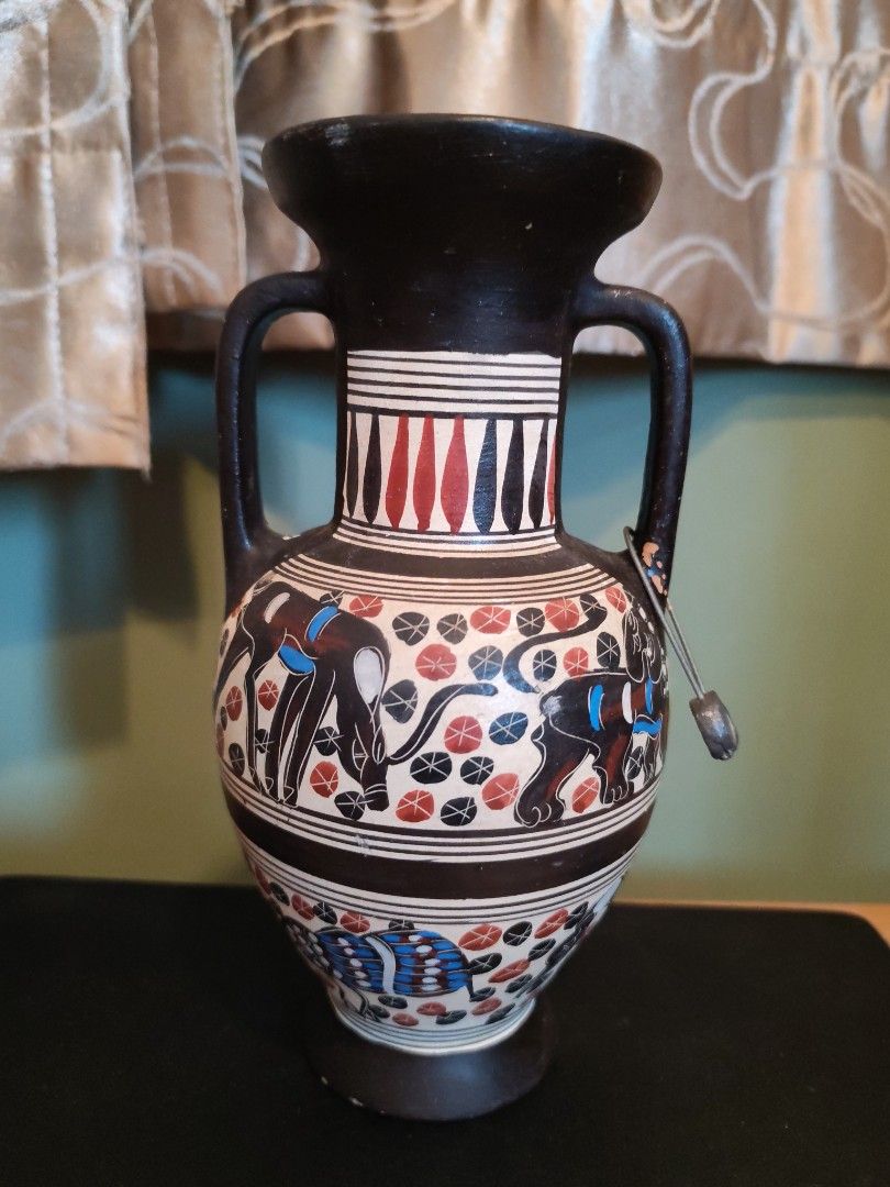 Decorative Amphora Vase with Ancient Greek Style Art (Category: Vases & Decorative Bowls) located in Kuala Lumpur. Submitted by gentlepenguin.6b8aad (Listing ID 1450663778, Image 3). Description: - Decorative amphora vase - Ancient Greek-inspired artwork - Features mythological creatures and geometric patterns - Colors: Black, red, and blue - Two handles and a flared rim - Ideal for display or unique home decor.