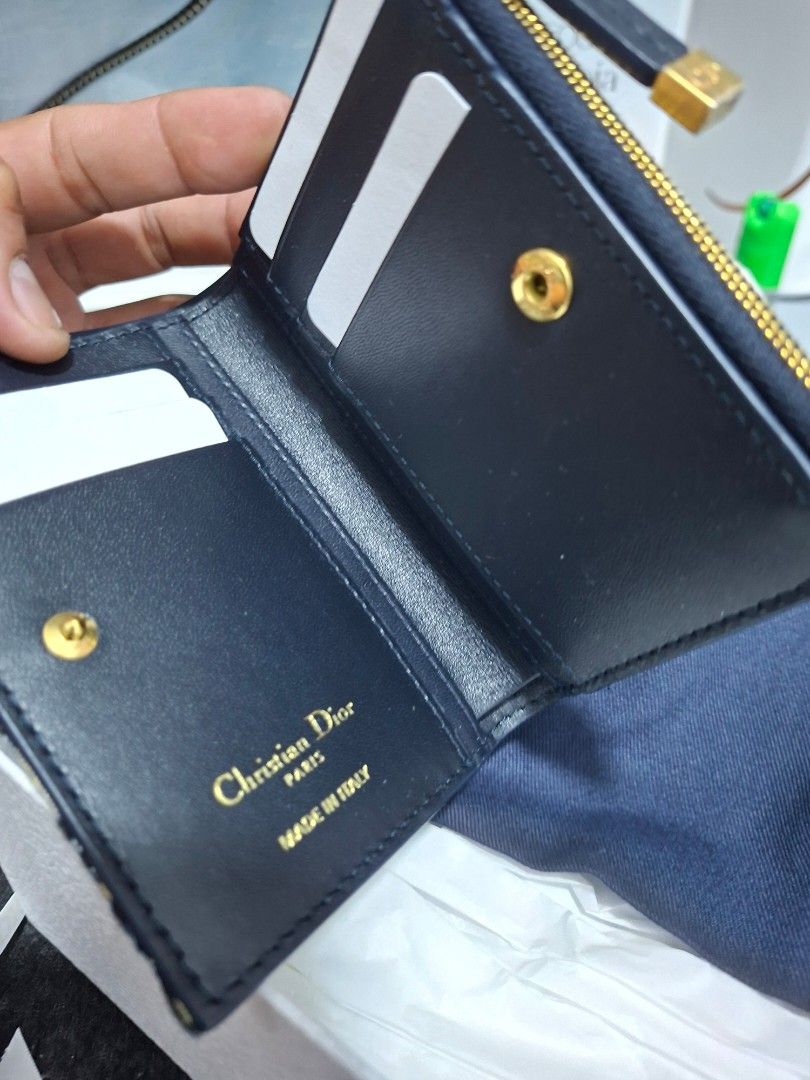 Dior Oblique Canvas Bifold Wallet (Category: Luxury Bags & Wallets) located in Manila. Submitted by sidney-dm (Listing ID 1450723547, Image 3). Description: - Authentic Dior Wallet - Iconic Oblique Canvas - Gold-tone Hardware - CD Clasp - Interior Card Slots - Interior Zip Pocket - Made in Italy - Comes with Dust Bag - Comes with Box.