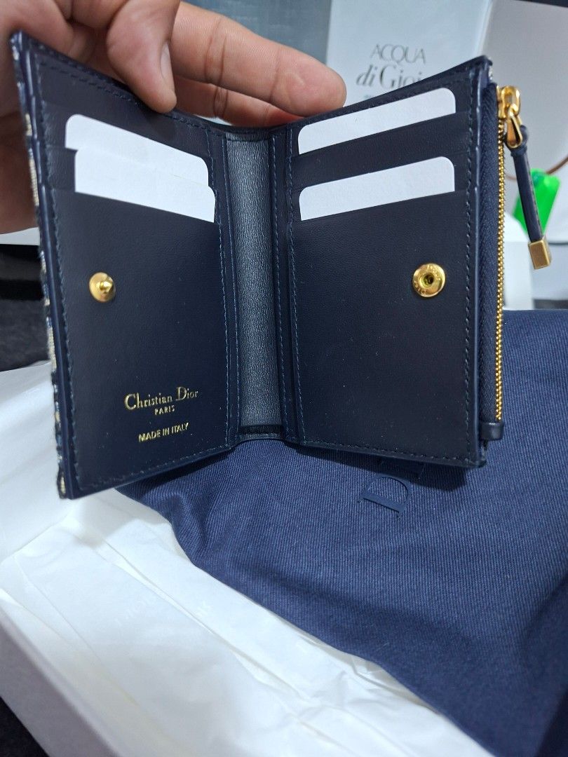 Dior Oblique Canvas Bifold Wallet (Category: Luxury Bags & Wallets) located in Manila. Submitted by sidney-dm (Listing ID 1450723547, Image 2). Description: - Authentic Dior Wallet - Iconic Oblique Canvas - Gold-tone Hardware - CD Clasp - Interior Card Slots - Interior Zip Pocket - Made in Italy - Comes with Dust Bag - Comes with Box.