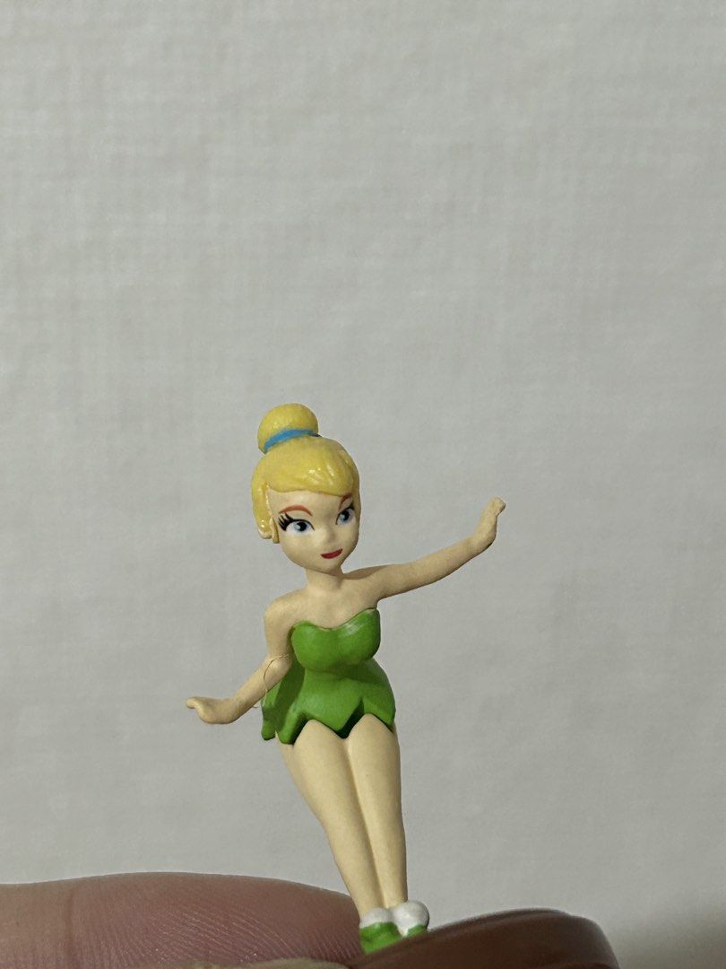 Disney Tinkerbell Mini Figurine Toy (Category: Figurines & Statues) located in Pateros City. Submitted by cleanmycloset (Listing ID 1450649776, Image 2). Description: - Adorable Tinkerbell figurine - Fun, adventurous pose - Ideal for Disney fans and collectors - Small and highly detailed - Great for display purposes - A fun collectible piece.