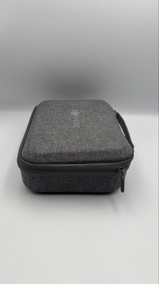 DJI Mavic Drone Carrying Case (Category: Drones) located in Manila. Submitted by mysticstar_d67ad3_tree (Listing ID 1450662168, Image 2). Description: Never used. Switch to a hard plastic case the moment I bought the unit. - Grey hard shell case for DJI Mavic drone - Zipper closure with a comfortable handle - Custom foam cutouts for drone, controller, and accessories - Provides excellent protection during transport - Perfect for travel and secure