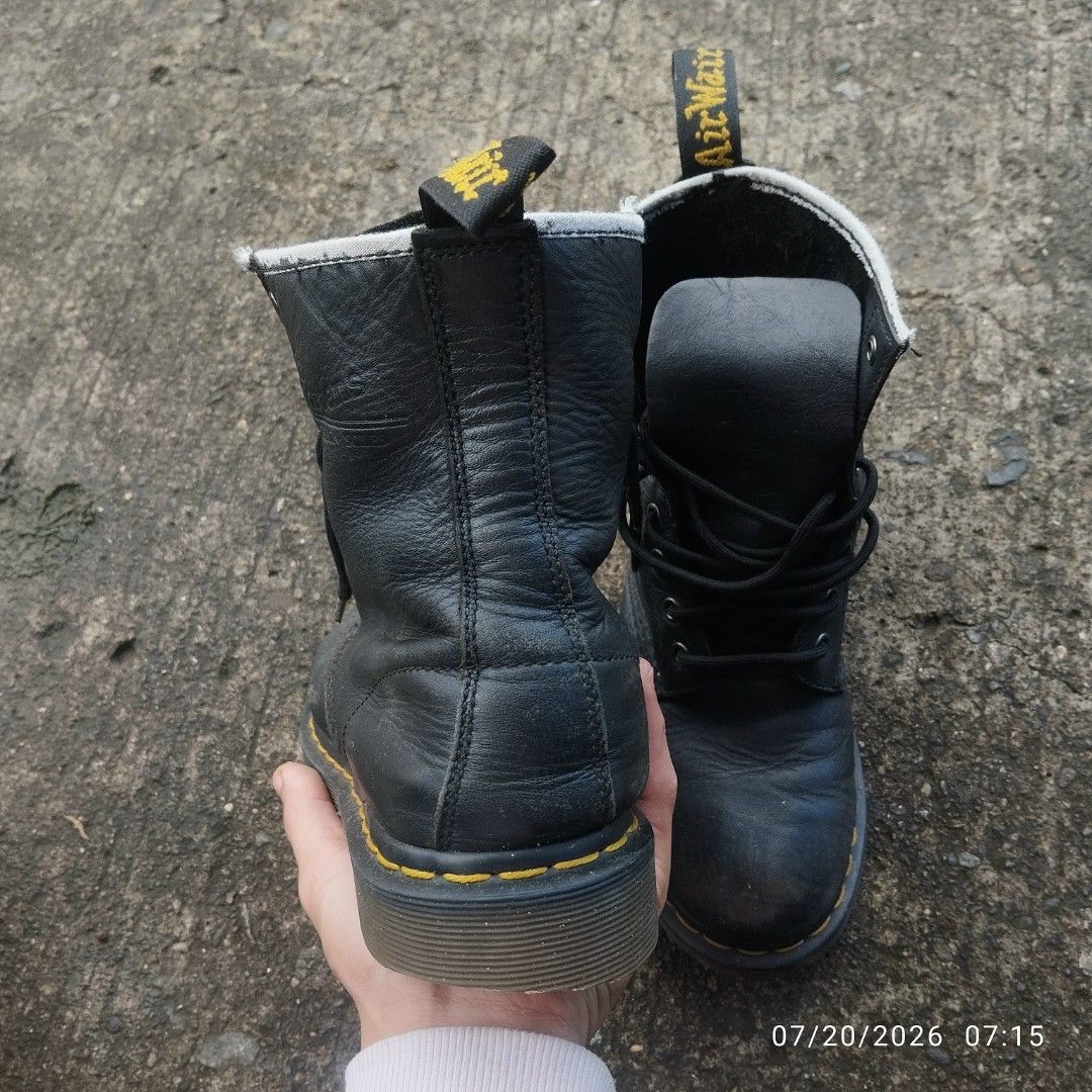 Dr. Martens Black Leather Lace-Up Boots (Category: Boots) located in Aguinaldo. Submitted by oddrabbit_3fd558 (Listing ID 1450734182, Image 3). Description: - Classic black Dr. Martens boots - Genuine leather - Original AirWair air-cushioned sole - Secure lace-up closure - Perfect for everyday wear - Shows some scuffs and wear on soles, consistent with use.