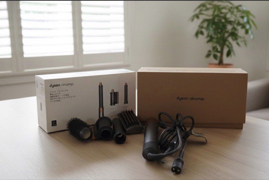 Dyson Airwrap (100-V JAPAN) (Category: Hair) located in Mandaluyong City. Submitted by Declutter_Princess (Listing ID 1450576486, Image 3). Description: Please read details! 👇🏻 SALE! Dyson Airwrap ✅With 3 attachments in the box, originally ✅Bought extra roller brush attachment from Dyson(4k+ in peso conversion) ✅No issues. In perfect working condition (just minor scratches on the wand from normal use but purely visual and do not affect performa