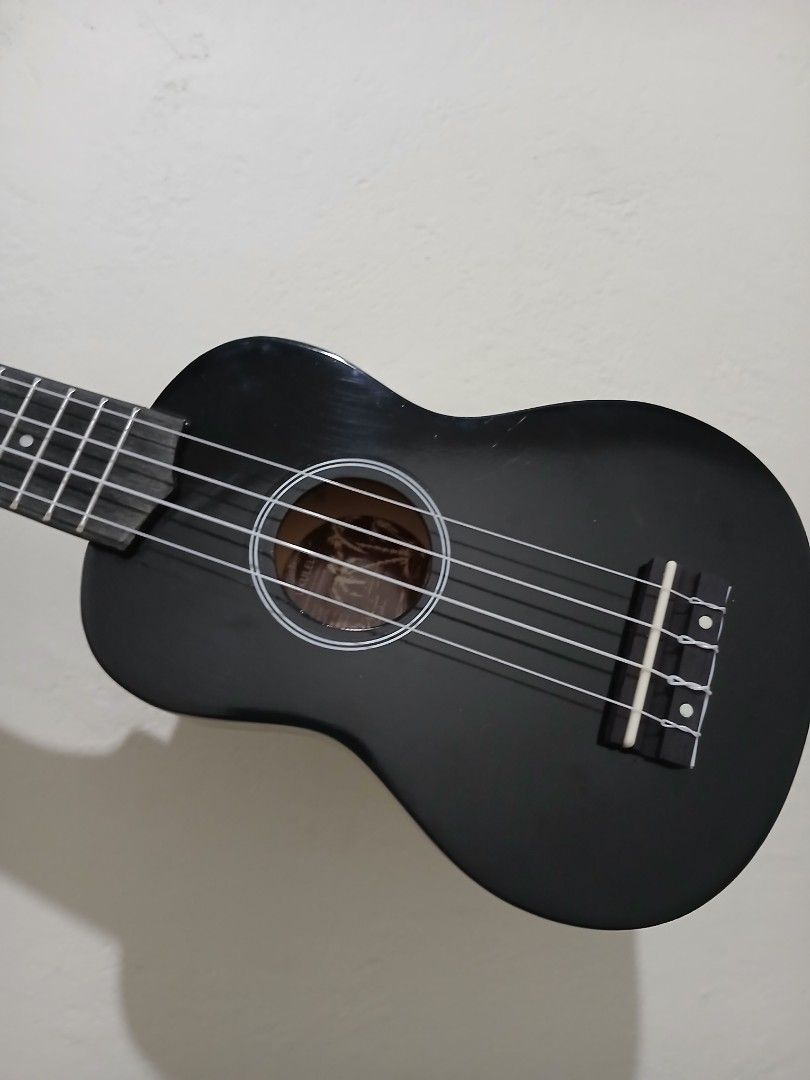 EVERJOYS 21" Black Ukelele (Category: Musical Instruments) located in Umingan. Submitted by eirevelle_thrifts (Listing ID 1450666888, Image 3). Description: Condition: Fully functional and plays well. There is a white discoloration on the wood around the bridge (where the strings are attached). I'm not sure what caused it, and it doesn't come off when wiped. It appears to be a cosmetic issue only and does not affect the sound or playability. Incl